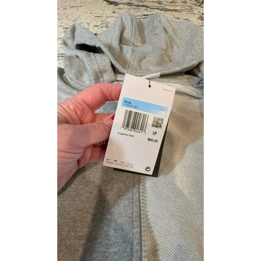 Kids size MEDIUM NIKE oversized fit gray zip up hooded jacket.